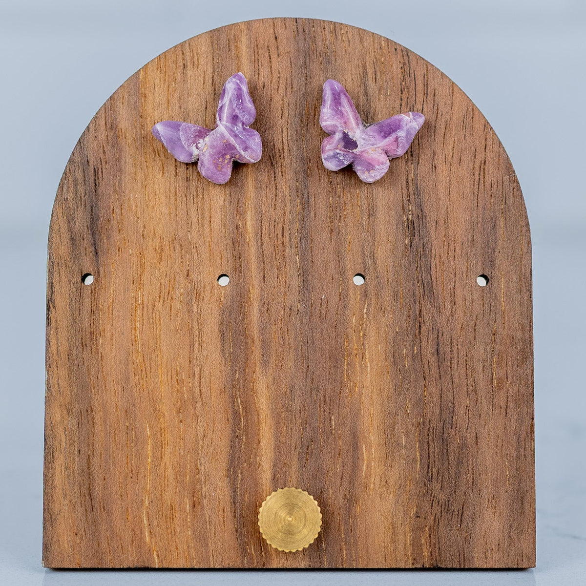 Wooden earring stand with butterfly-shaped earrings
