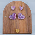 Wooden earring stand with purple heart-shaped earrings