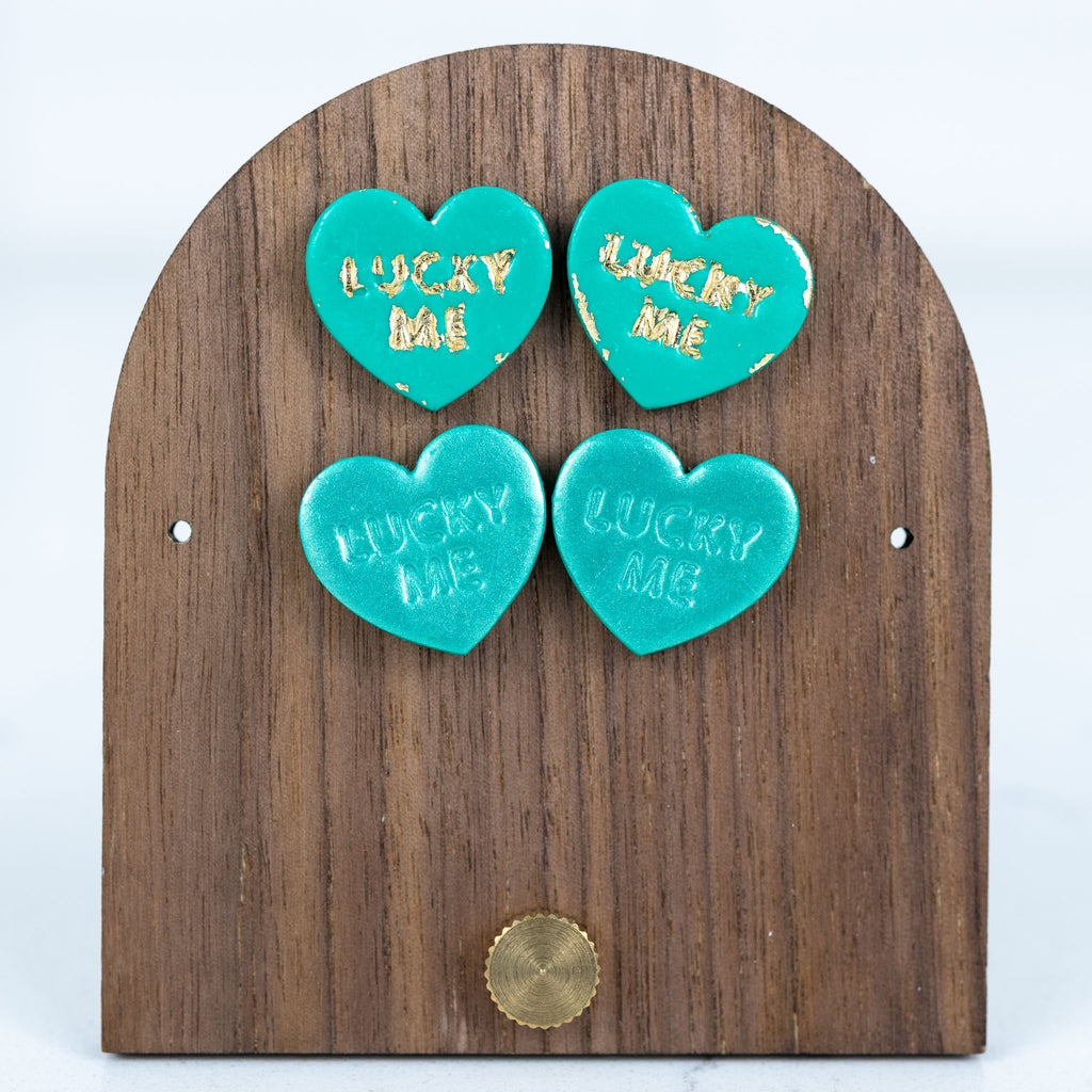 Green lucky me heart polymer clay stud earrings with gold lettering detail