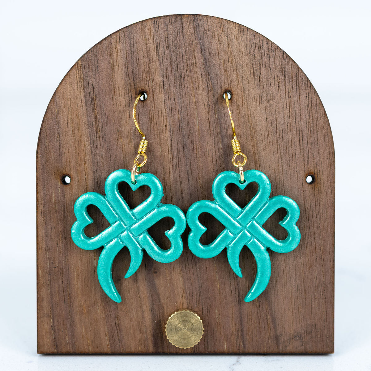 Green four leaf clover earrings made of heart shapes with gold hooks