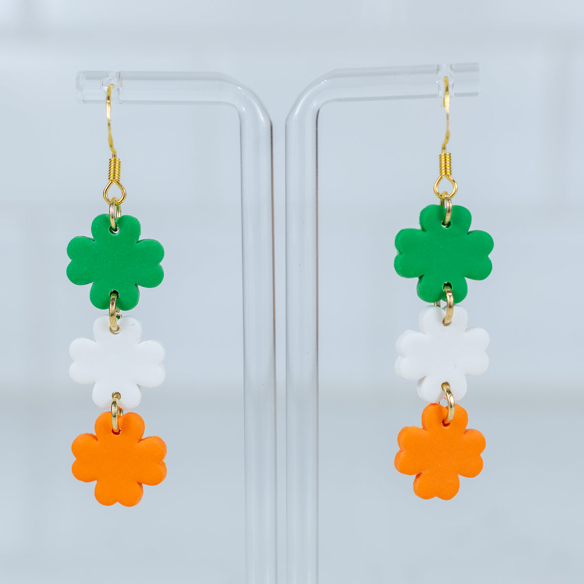 Irish flag shamrock polymer clay dangle earrings in green, white, and orange