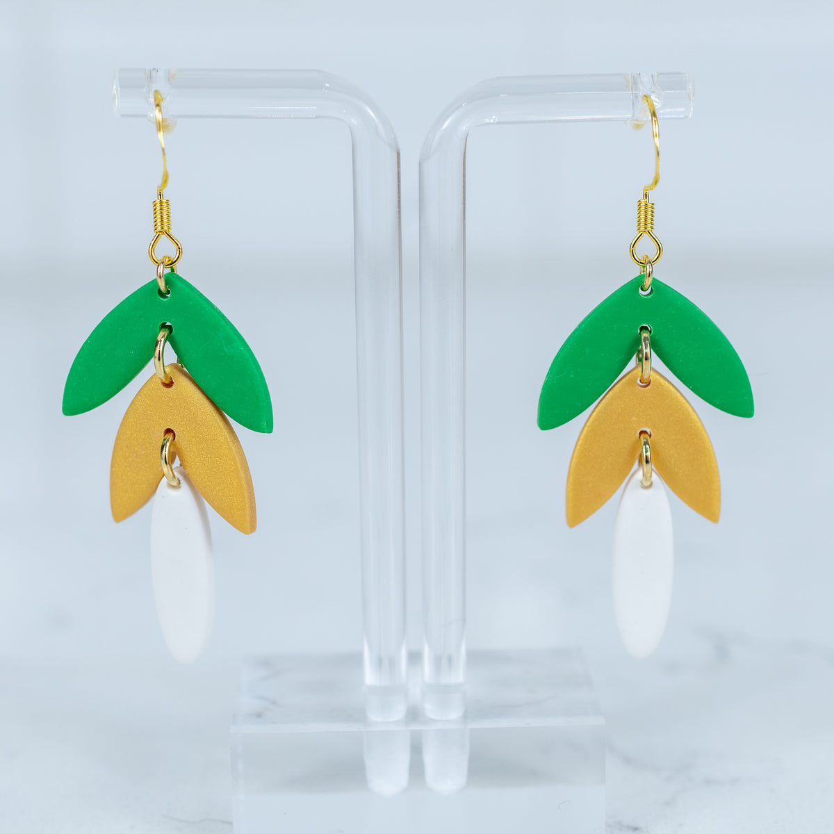 Green and gold layered polymer clay dangle earrings with gold hook hardware