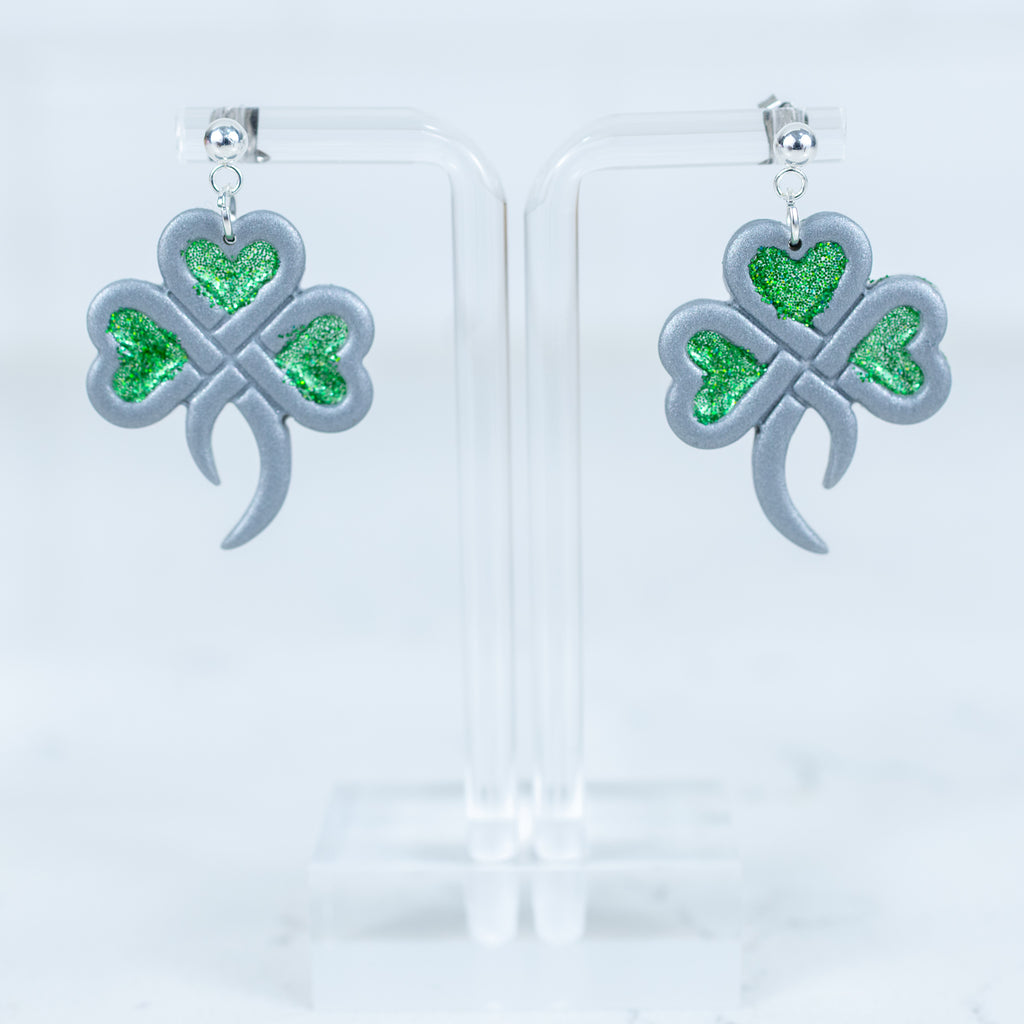 Silver shamrock earrings with green glitter heart accents and silver ball srud