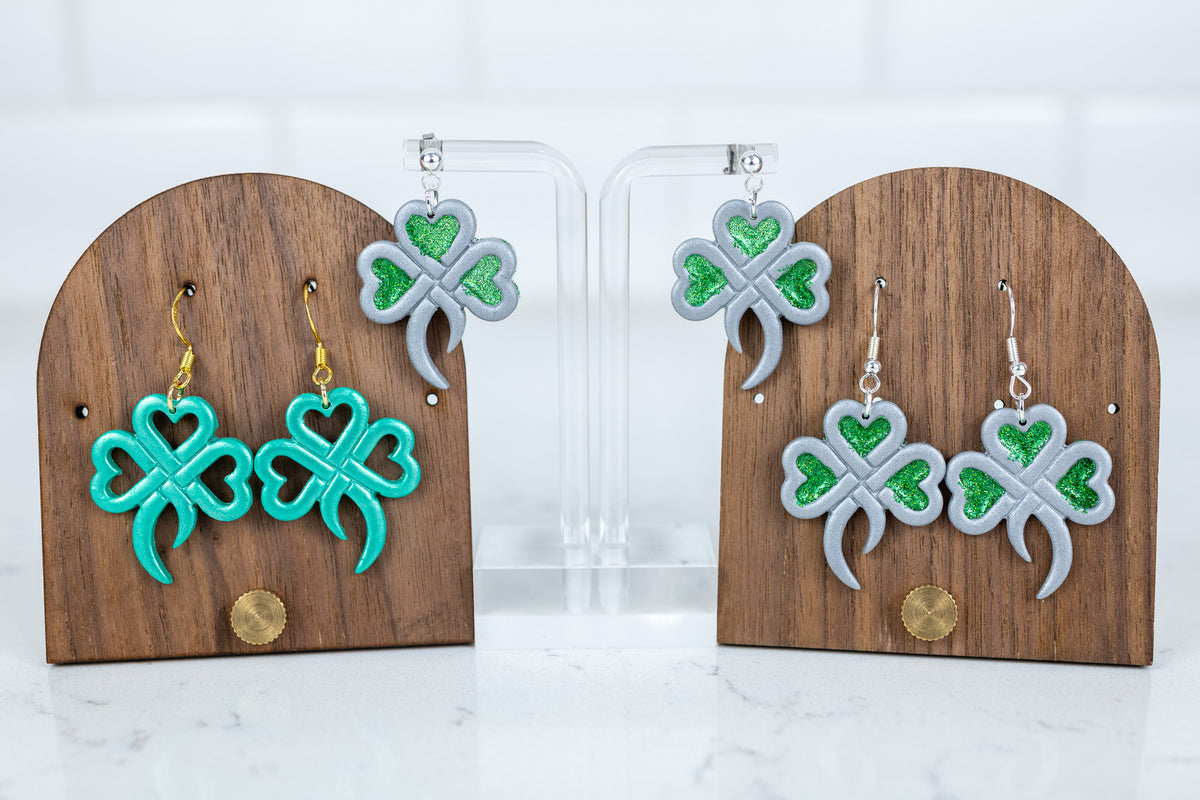 Heart shamrock polymer clay dangle earrings in green and silver with glitter accents