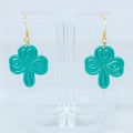 Teal embossed shamrock polymer clay dangle earrings with gold hook hardware