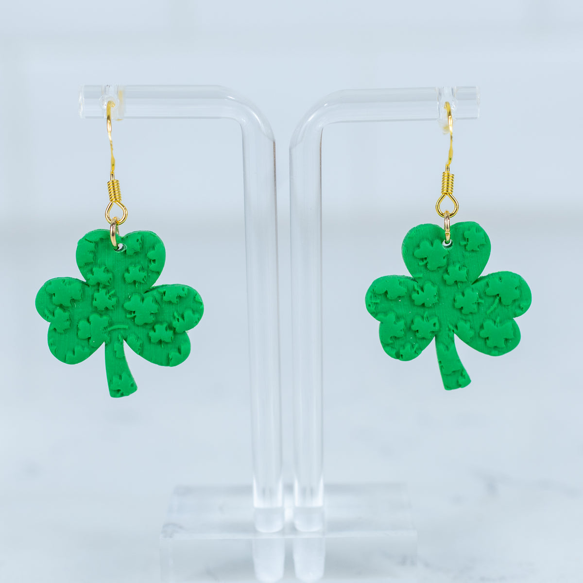 Textured shamrock polymer clay dangle earrings with gold hook hardware